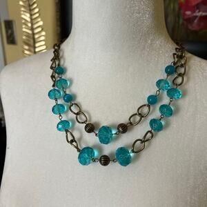 Teal double strand beaded and brass necklace.